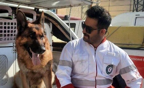 Kianoush Fallahi, a search and rescue dog trainer, alongside his dog Zhiro in western Tehran.