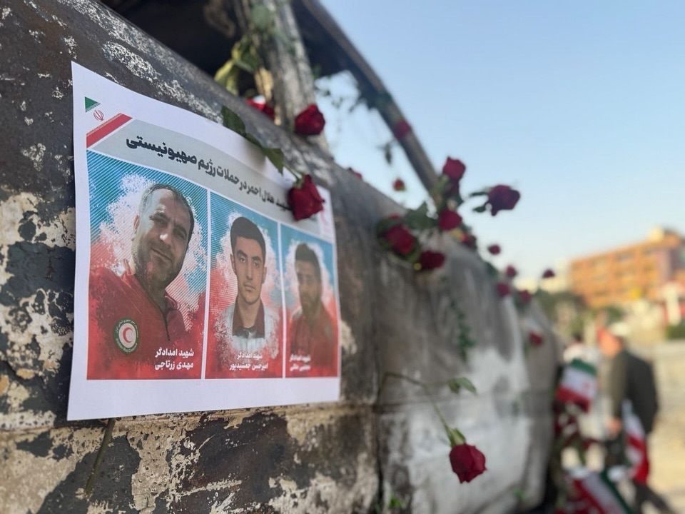 A Red Crescent ambulance that came under attack is placed in Tehran’s central square to commemorate the emergency workers who were killed in the conflict.  