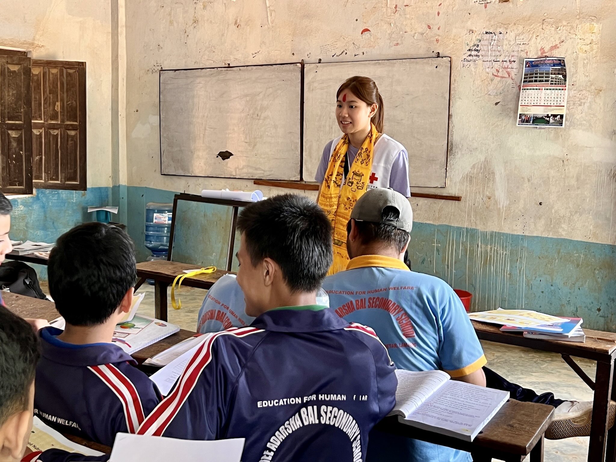 Tam Wai Yan Dorothy speaks to school children in Nepal as part of a nine-day programme organized by the Hong Kong Red Cross University Club. The aim of the trip was to promote health education, community engagement, humanitarian values and international, cross-cultural cooperation.