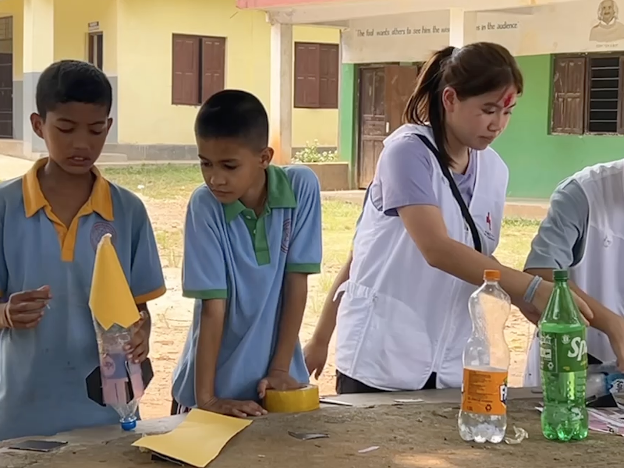 Tam Wai Yan Dorothy working alongside school children in Nepal in one of many exercises aimed at promoting health education, community engagement, humanitarian values and international, cross-cultural cooperation.