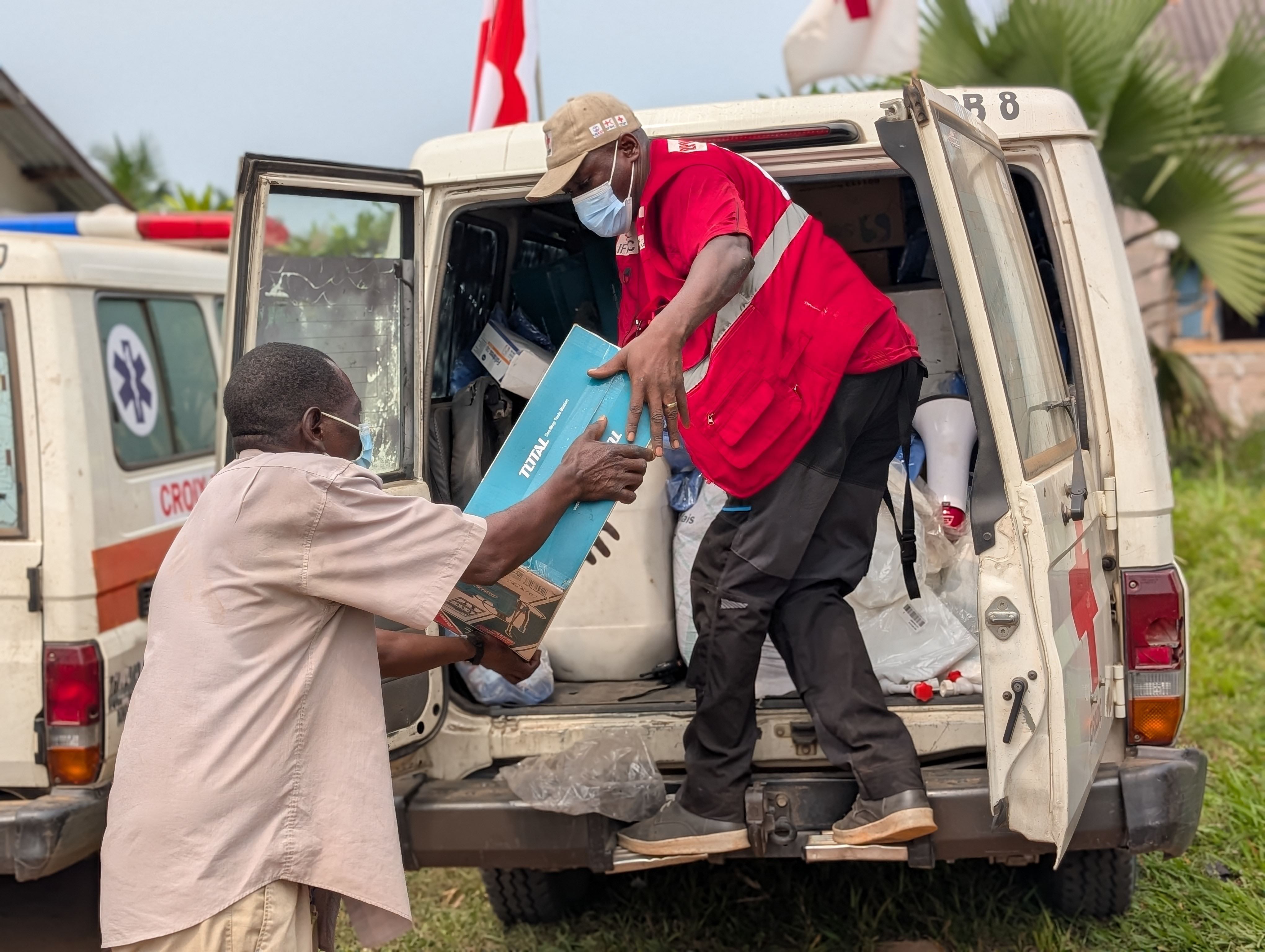 Volunteers for the Red Cross of the Democratic Republic of the Congo unload emergency supplies to contain the 2025 Ebola outbreak.