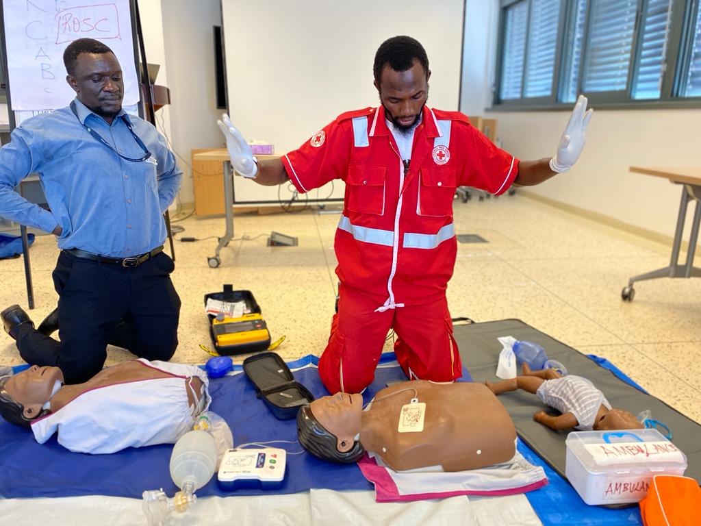 A Uganda Red Cross first aid training instructor shows proper Cardiopulmonary Resuscitation (CPR) techniques during a recent workshop.