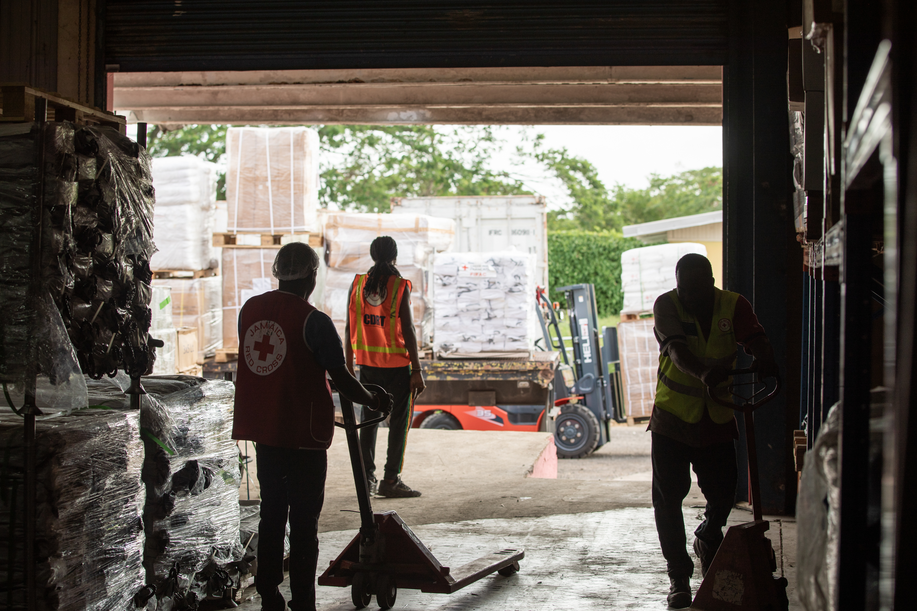 A shipment of 50 tons of humanitarian aid being unloaded into the warehouse at the Jamaica Red Cross Headquarters in Central Village, St Catherine.