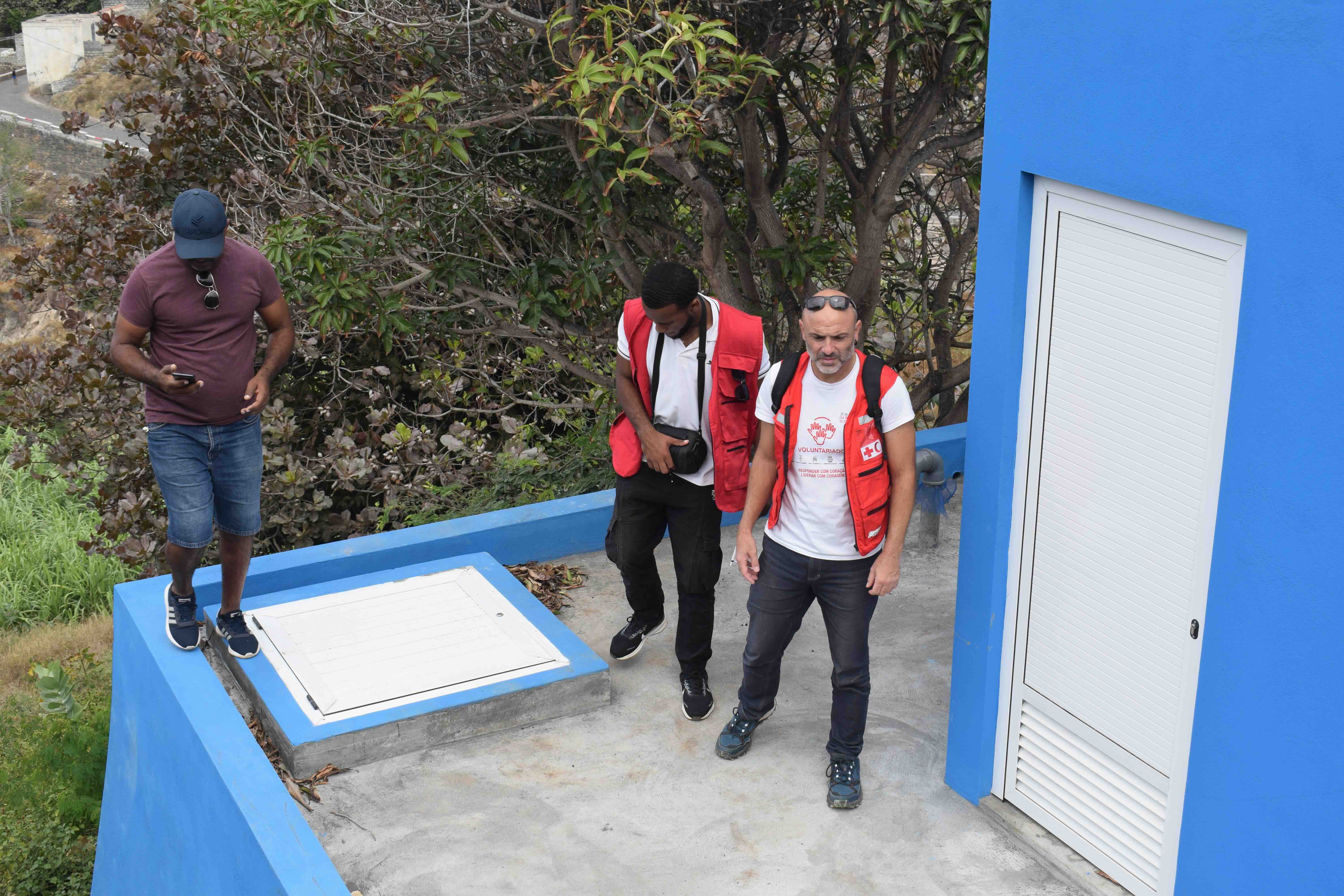 IFRC and Red Cross staff inspect a water facility refurbished through the IFRC’s cash-for-work programme.