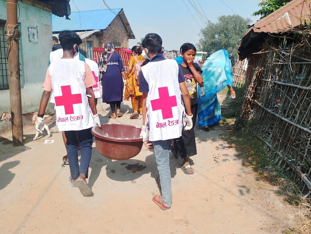Nepal Red Cross volunteers in the rural municipality of Chhinnamasta support local authorities with cleaning operations aimed at reducing transmission of Cholera in the outbreak area.