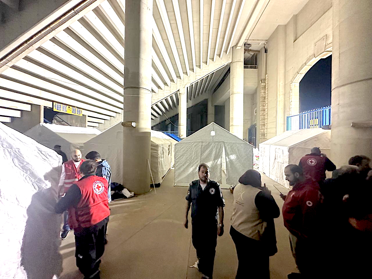 At the Camille Chamoun Sports City Stadium in Beirut, Lebanese Red Cross teams set up tents and provide critical services in order to ensure people can maintain their health and have access to safe shelter.