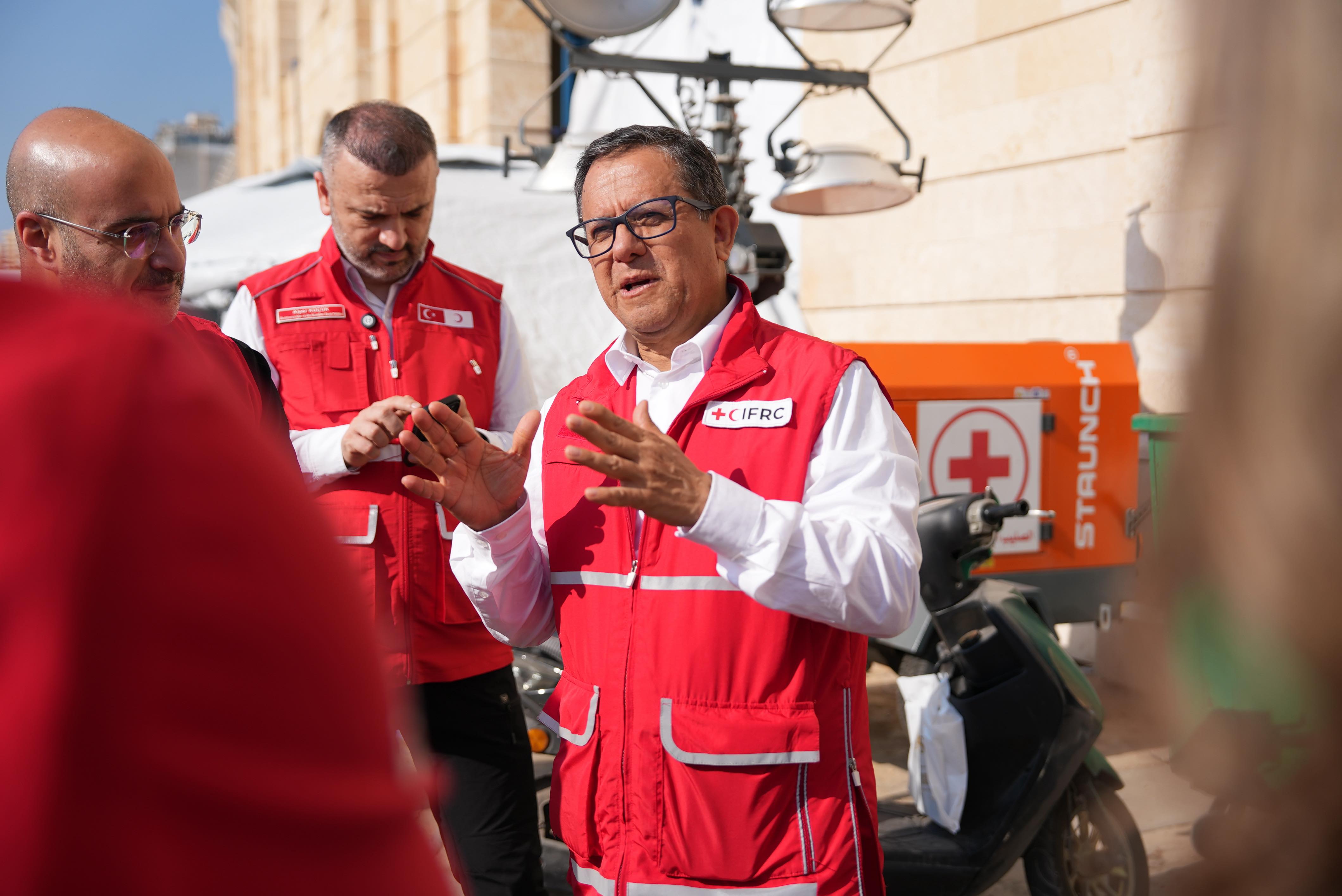 Xavier Castellanos, IFRC Under Secretary General for National Society Development and Operations Coordination, meeting with Lebanese Red Cross volunteers and staff at the Camille Chamoun Sports City Stadium, where they help manage shelters for people displaced by the fighting.