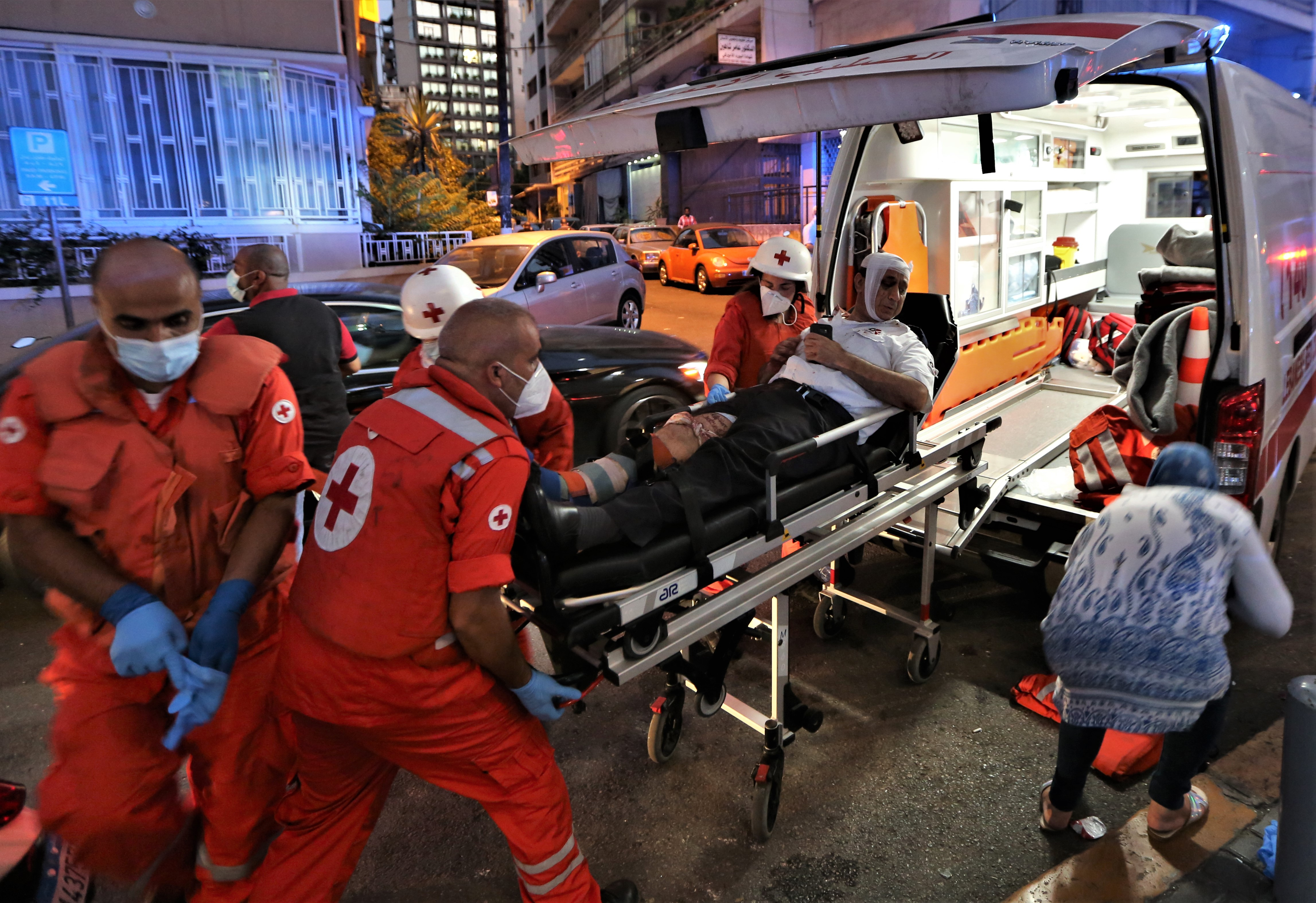 Medics shift an injured person from Najjar Hospital to another hospital in Al-Hamra area in Beirut after Port explosion, in Beirut, Lebanon, 04 August 2020. According to media reports citing official 