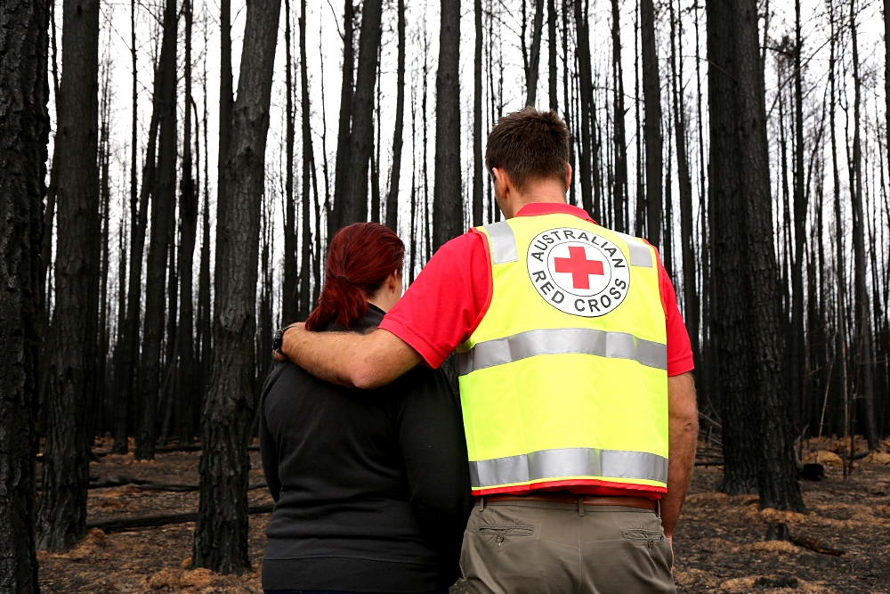 Australia, bushfires, 2020.Red Cross staff member Jai O'Toole on Kangaroo Island standing in burnt landscape on Kangaroo Island, South Australia. Extreme temperatures, dry conditions and winds have co