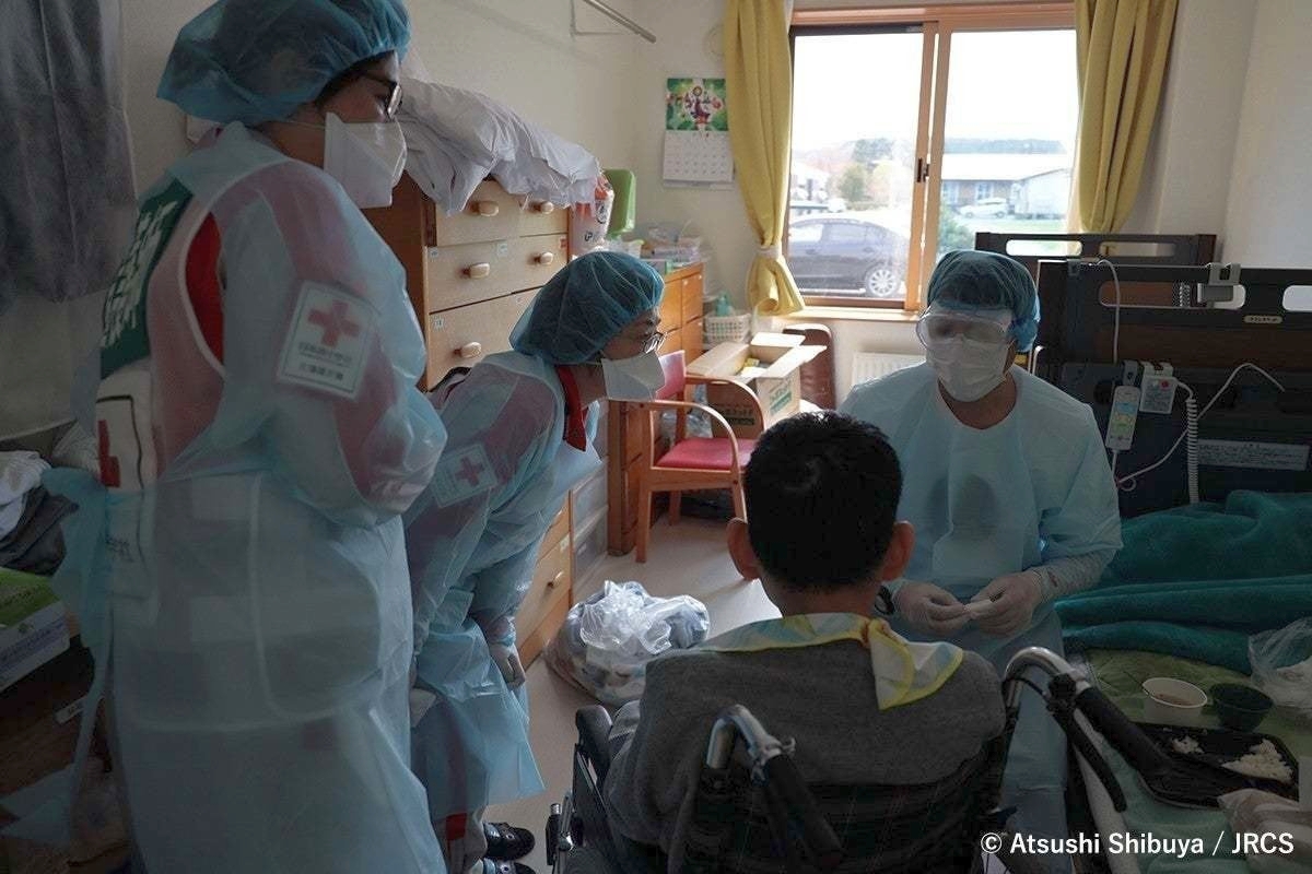 Japan, November 2021. The Red Cross medical team check the health condition at residents in their rooms at the Koyoen disability welfare facility in Monbetsu-gun, Japan.Koyoen facility was supported b