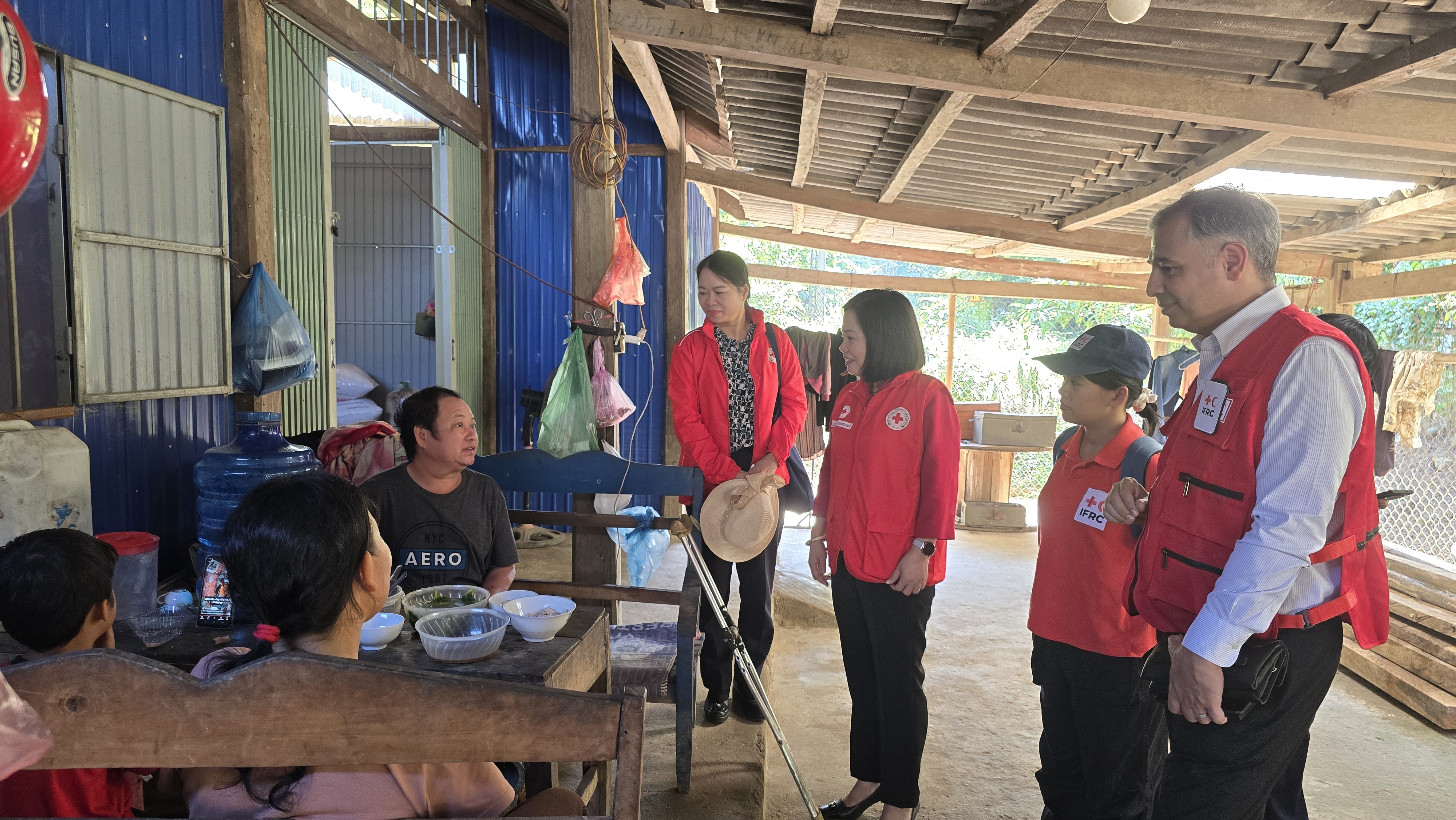 The Viet Nam Red Cross during a visit to Mrs. Ngo Thai Do and her family. Photo credit: Kwanta Norkum, IFRC 