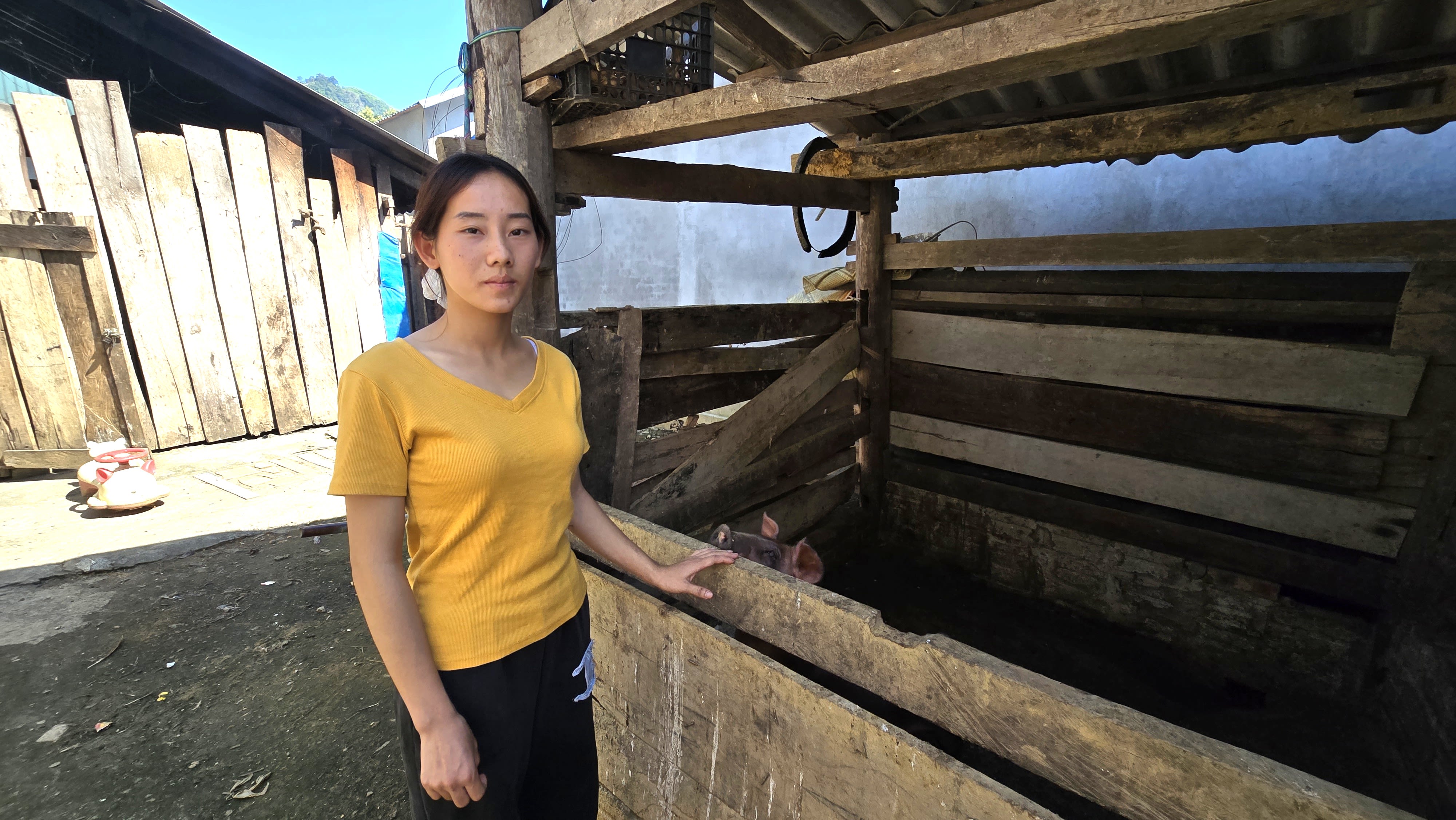 Mrs. Hoang Thi Sua, a 20-year-old mother of two young children.