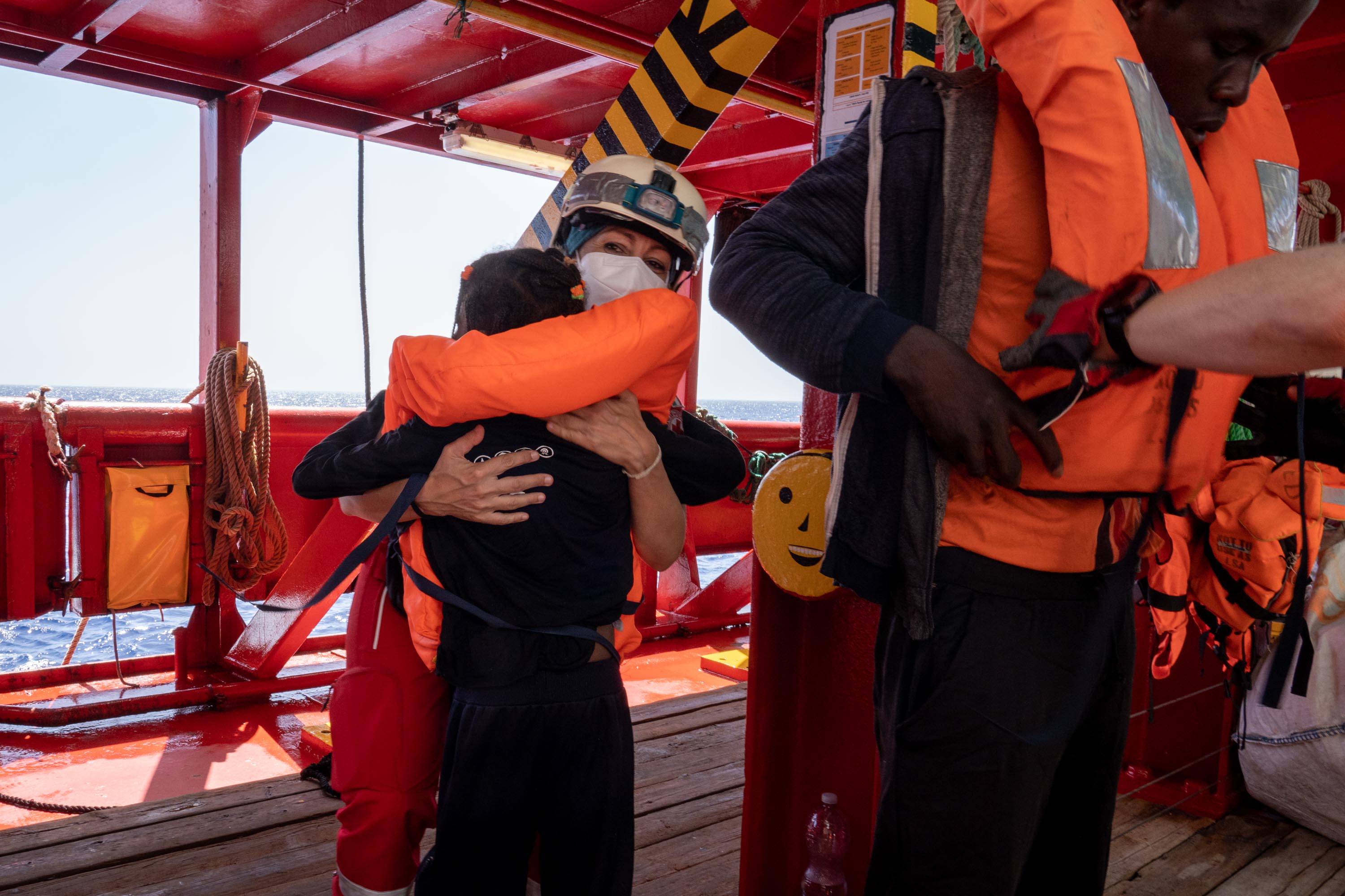 Sara Mancinelli gives a warm IFRC hug to a recently rescued person aboard the Ocean Viking. Photo: IFRC