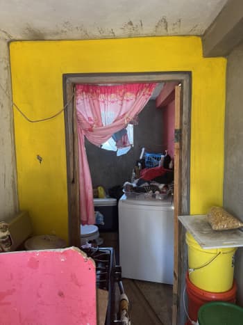 During the hurricane she sheltered with her daughters in their concrete bathroom, the only room in their house still standing.
