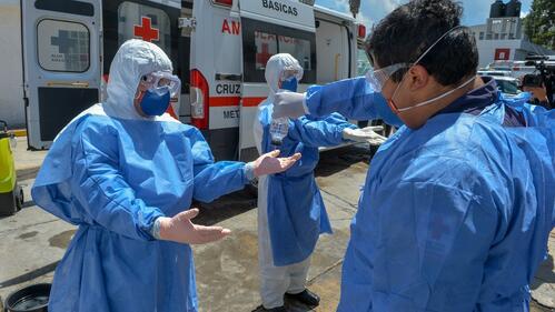 Paramedics from the Mexican Red Cross wear personal protective equipment as they respond to the COVID-19 pandemic across the country in 2020