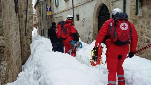 Italian Red Cross volunteers recue people affected by an avalanche that engulfed a hotel in Abruzzo region following earthquakes in January 2017
