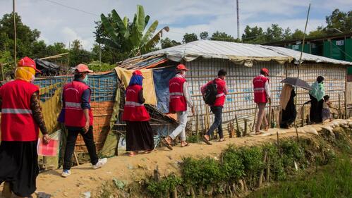 In Cox's Bazar, Bangladesh Red Crescent Society volunteers, with support from the IFRC and partners, conduct door-to-door health visits during the COVID-19 pandemic.