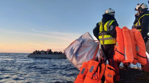Search and rescue crews on board the Ocean Viking rescue ship approach a boat in distress in the Central Mediterranean in February 2022