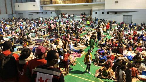Malagasy Red Cross volunteers provide relief items and services to thousands of people in a temporary accommodation centre set up in January 2022 to help people affected by torrential rains, Tropical Storm Ana and Cyclone Batsirai.