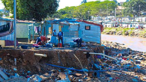 People in KwaZulu-Natal province, South Africa inspect damage to their house caused by devastating flooding that hit the region in April 2022