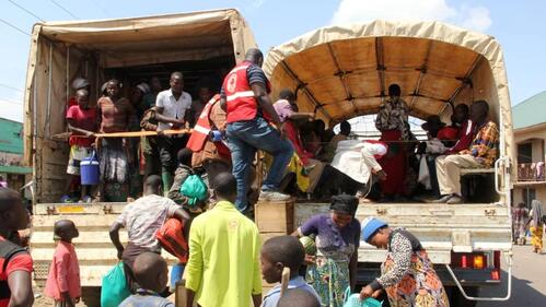 People fleeing violence in the Democratic Republic of the Congo are received at the Bunagana border point in Uganda where refugees receive support from the Uganda Red Cross Society