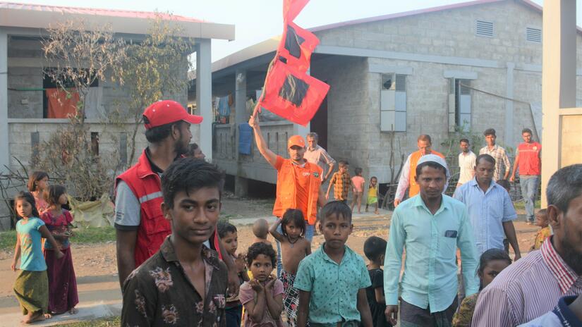 Bangladesh Red Crescent volunteers at Bhasar Char Island conduct activities to help displaced people living there with day-to-day routines. 