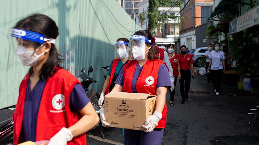 A mobile unit of the Viet Nam Red Cross in Ho Chi Minh city is seen carrying out COVID-19 vaccinations for elderly, immobile and vulnerable residents.