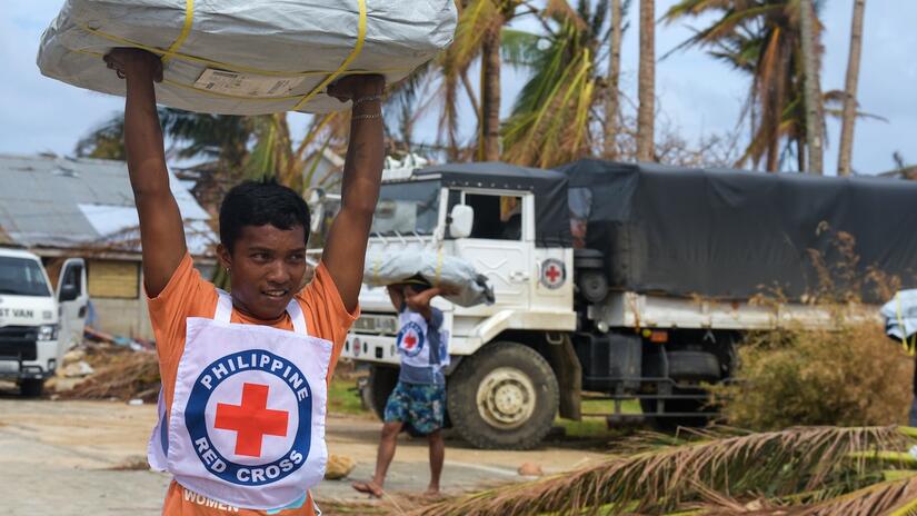 Philippine Red Cross volunteers are providing tarpaulins, shelter supplies and tool kits to help people rebuild after losing their homes in Typhoon Rai which struck the country in December 2021.