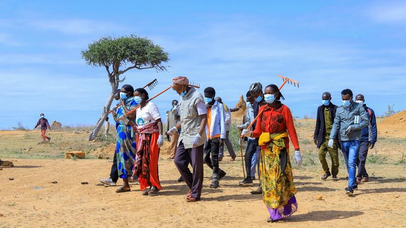 Ethiopian Red Cross volunteers help communities in Moyale, Ethiopia dispose of dead livestock and clear water points to protect people's health. Recent prolonged drought has led to an increase in livestock deaths, widespread food insecurity, and displacement as people search for grasslands.
