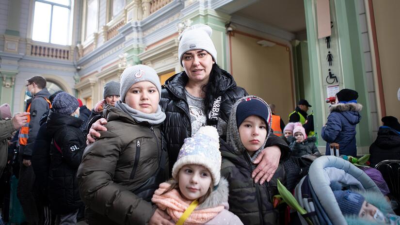 Tanja and her three children from Krivoy Rog in central Ukraine wait to board a train to Poland in March 2022 to escape bombing close to her home.