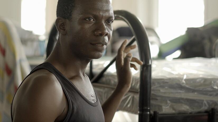 Francis Icabba from Sierra Leone stands in a reception centre run by the Panamanian Red Cross that hosts migrants arriving from the Darien.