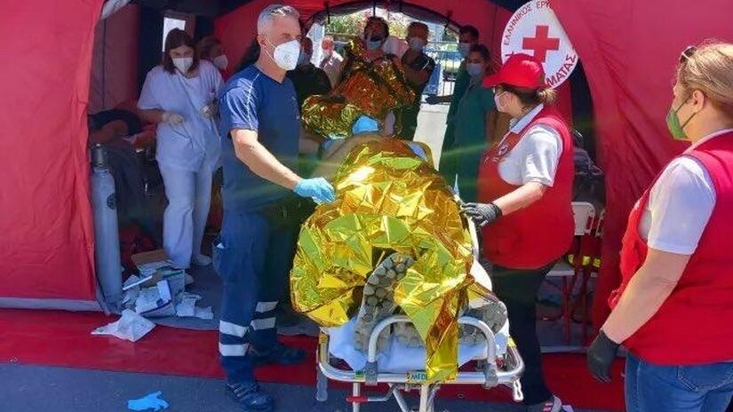 Hellenic Red Cross volunteer teams support rescue efforts and provide first aid, basic aid items and food to people rescued from a capsized boat off of Greece. Hundreds were on board and many are now missing.