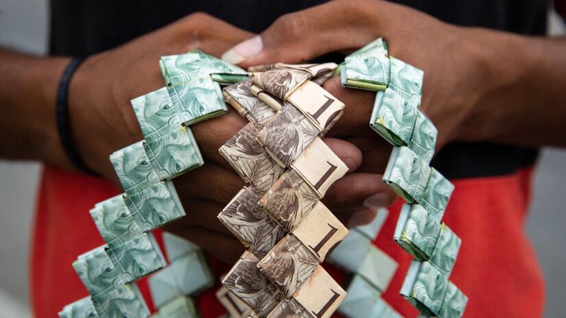 Close up of woven items made out of Venezuelan money, sold by Jesus and Gabriela Campos in Colombia to try and make money for a new life.
