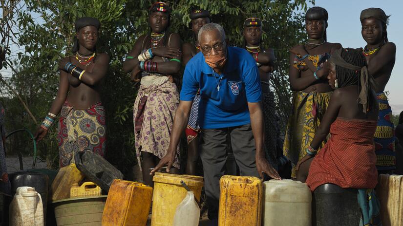 Konguari helps migrants arriving from Angola to access water by running a garden house from his house.