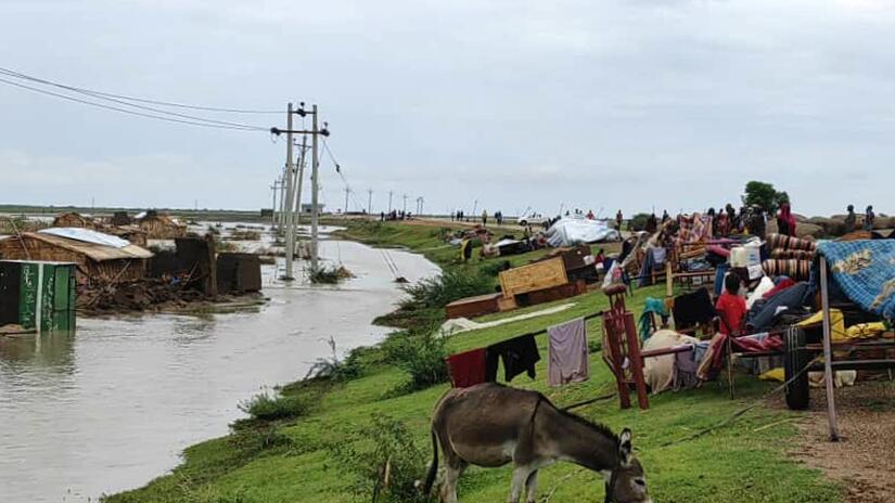 Communities in White Nile State, Sudan, move their belongings uphill after flood waters washed away homes and belongings in early August 2023.