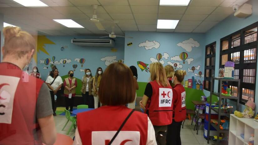 A team from the IFRC meets at the Center of Attention for Migrant Children and Families, located in Belen, Honduras.