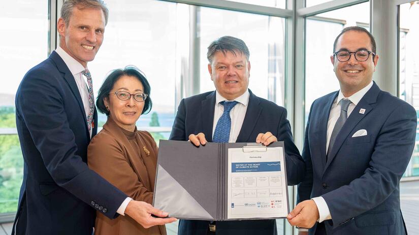 "Water at the Heart of Climate Action" partners stand with a newly signed collaboration agreement at the UN General Assembly in September 2023.
