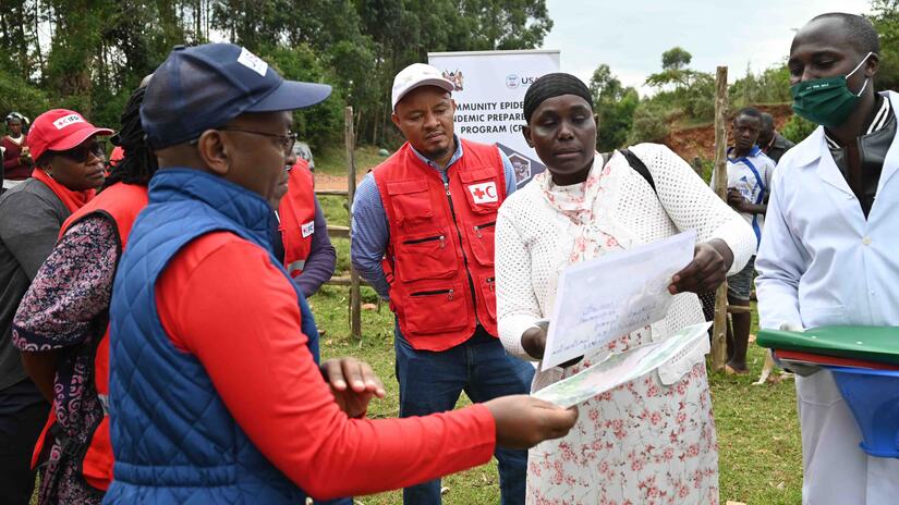 Chebett, a community health worker trained by the Kenya Red Cross, shares information about prevention of water-borne diseases