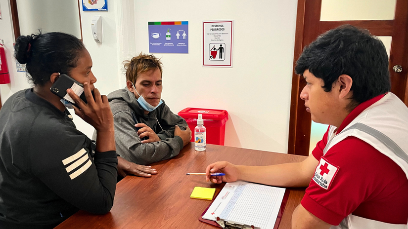 Cristia and Winston get to call their loved ones with assistance from Ecuadorian Red Cross.