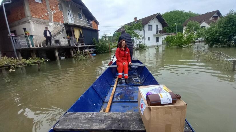 Local Red Cross branches deliver humanitarian aid by boat after floods hit Bosnia and Herzegovina in May 2023. 