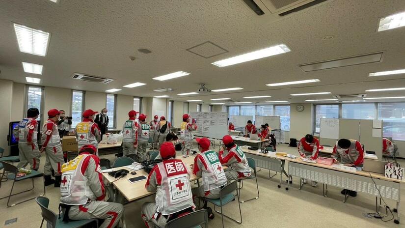Members of the Japan Red Cross Society during a coordination meeting to assess the impact of the earthquake. Challenges include power outages, internet disruptions, and transportation issues in affected areas. Photo: Japan Red Cross Society