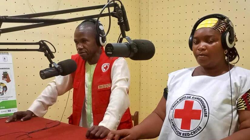 Cameroon Red Cross staff in the North region are interviewed as part of a radio show to help communities stay safe from cholera and other diseases.
