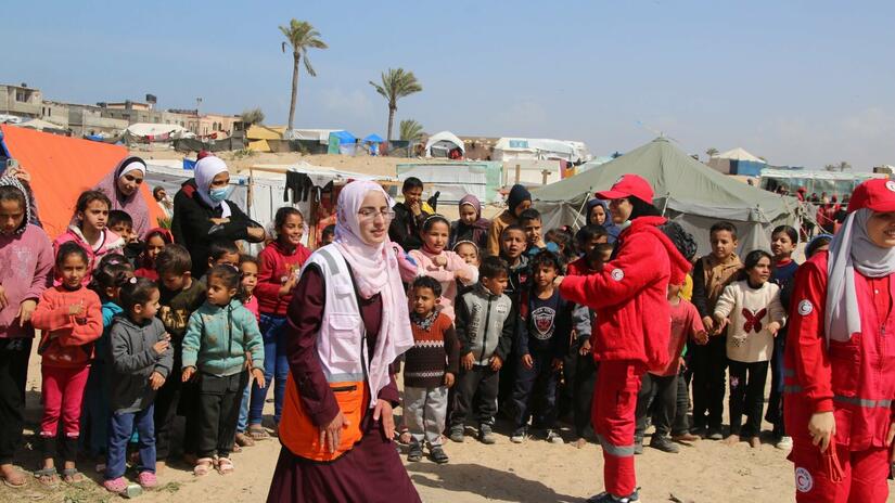 Women play a central role in all aspects of the Palestine Red Crescent’s emergency response to the middle east conflict. These volunteers bring some needed diversion to people living in a refugee camp.