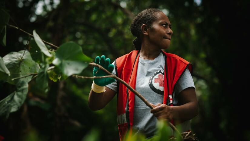 Tiffanie Boihilan, 27, is one of the Red Cross volunteers who helped with the riverbed clean up, which aims to ensure that debris and vegetation in the riverbed doesn’t block water flow and cause flooding in the nearby village of Solwe.