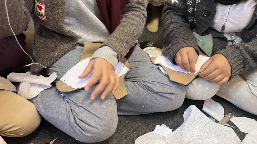 Women sew their own sanitary pads by hand in a workshop organized by the Moroccan Red Crescent and the IFRC.