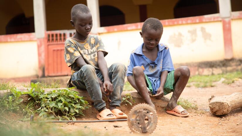 Ousmane plays with his friend after recovering from being bitten by a rabid dog with support from the Guinea Red Cross in Faranah, Guinea. 