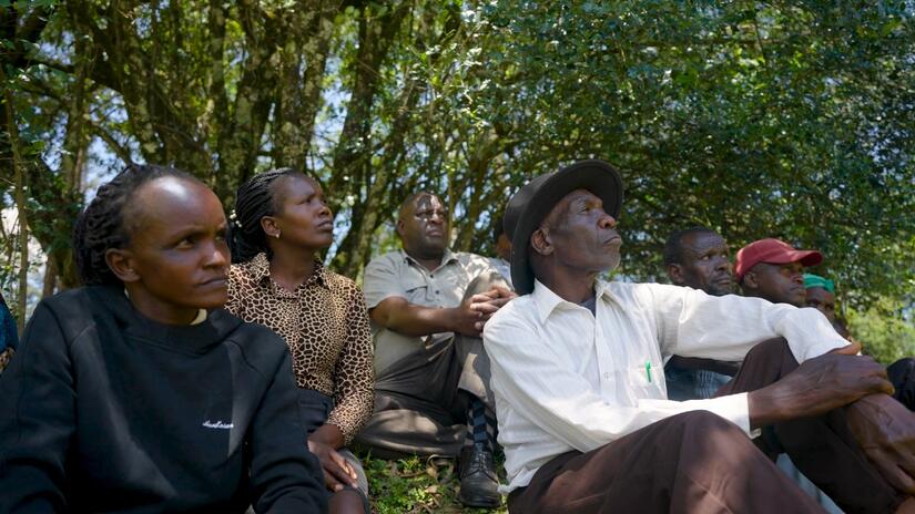 People in Kipajit listen intently to a Community Health Promoter talking about anthrax and other zoonotic diseases that can spread from animals to humans.