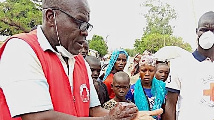 Hamasseo Borotia of the Cameroon Red Cross shares life-saving hygiene and health information with local communities impacted by outbreaks.