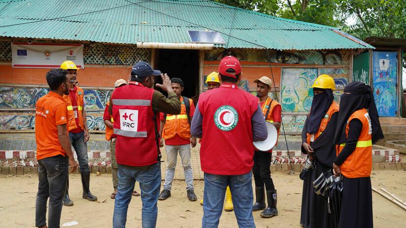 Bangladesh Red Crescent and the IFRC staff meet with Cox’s Bazar volunteers about camp cyclone preparedness plans.