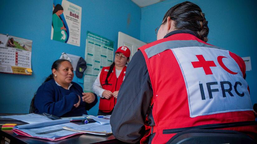 IFRC staff meeting with Guatemalan Red Cross as part of a project aimed at improving local health services.